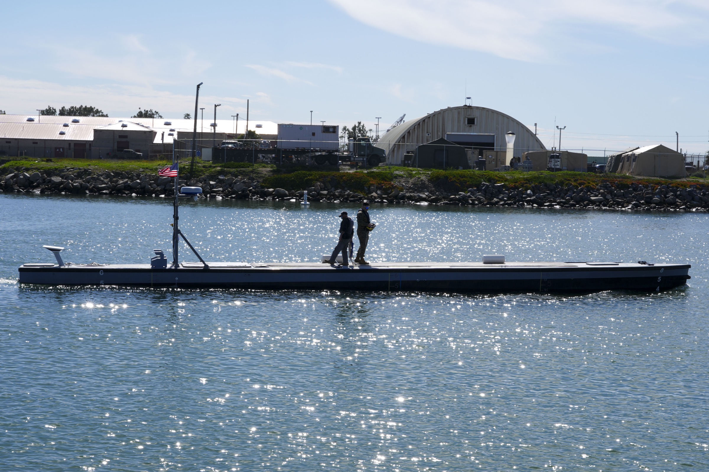 Autonomous low-profile vessel sails on Del Mar Boat Basin to test its capabilities as part of Project Convergence Capstone 4, February 23, 2024, at Camp Pendleton, California (U.S. Marine Corps/Kevin Ray J. Salvador)